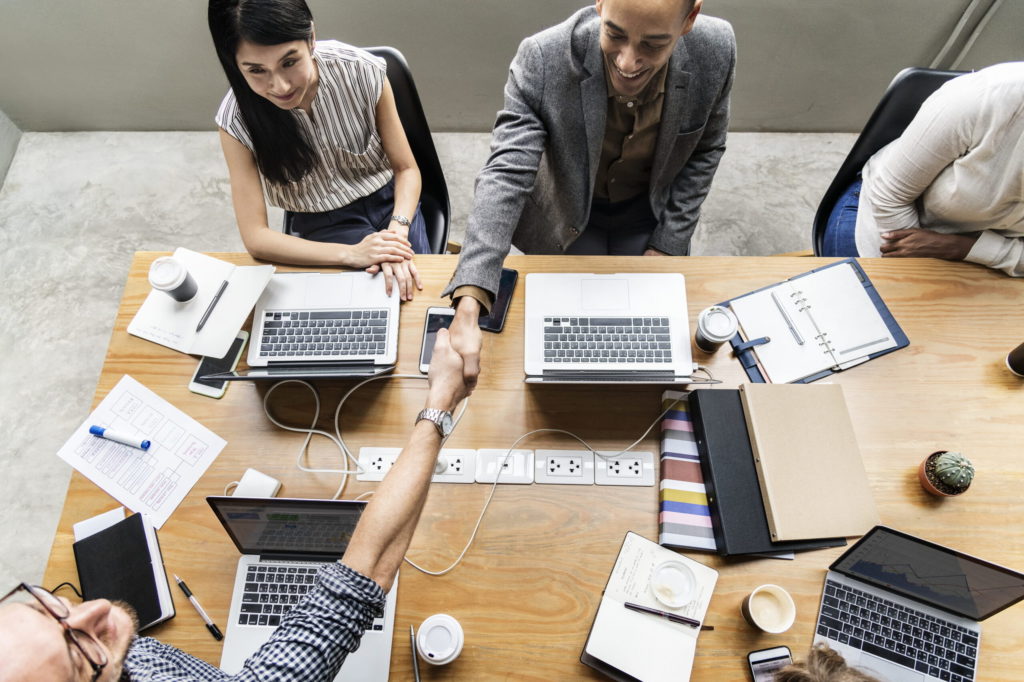 Business people shaking hands in agreement