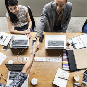 Business people shaking hands in agreement