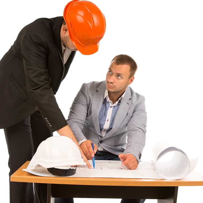 Architect discussing a plan with an inspector