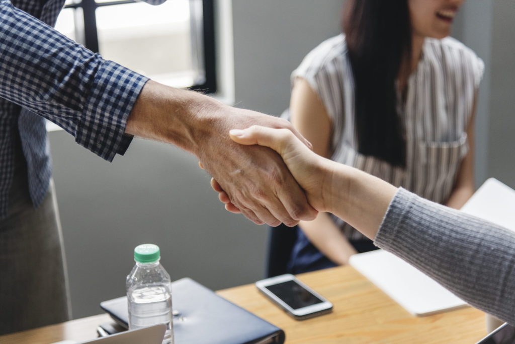 Business people shaking hands in agreement